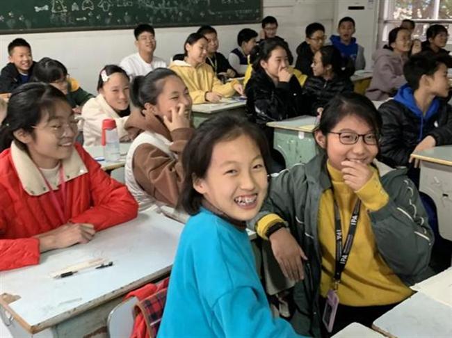 A group of people sitting at a table

Description automatically generated