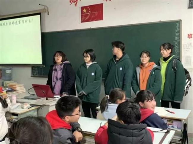 A group of people sitting at a table

Description automatically generated